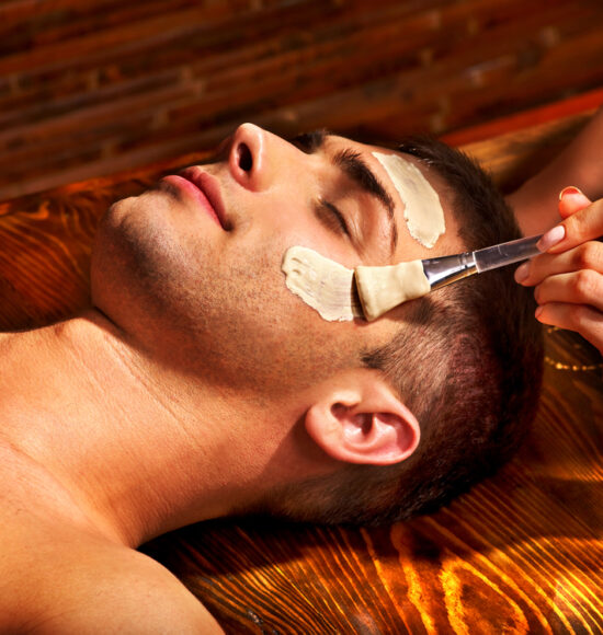 Man,With,Clay,Facial,Mask,In,Beauty,Spa.